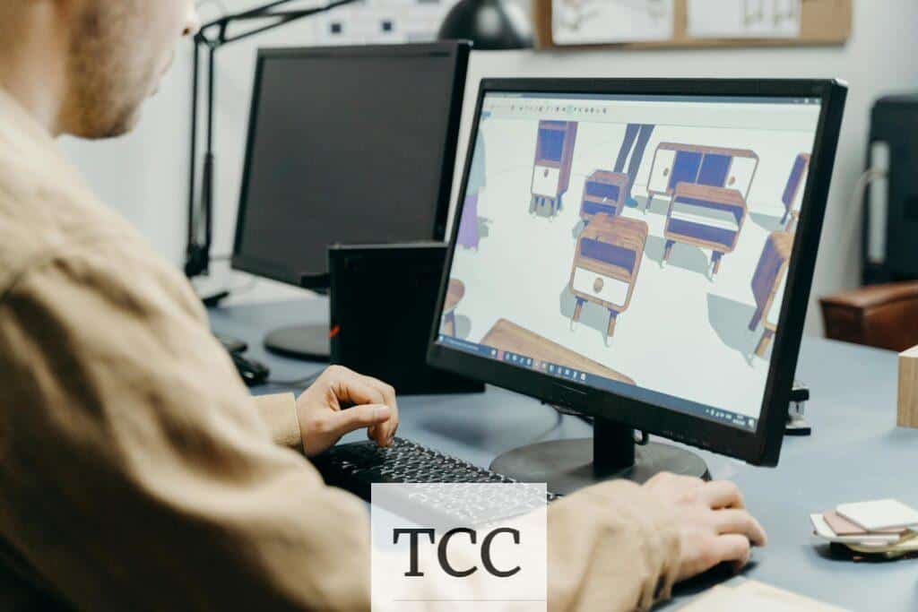 A Man Using a Computer in Designing