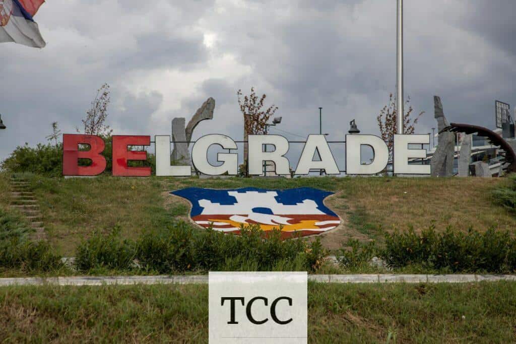 Colorful Belgrade sign with city emblem under an overcast sky, symbolizing Serbian pride.