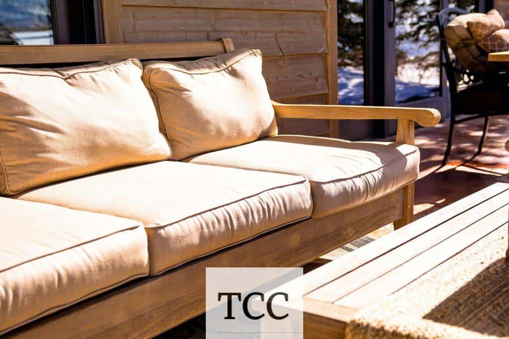 A comfortable outdoor patio seating area with cushions, offering a cozy and modern touch to any home.